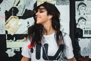 woman wearing white shirt near white printer paper